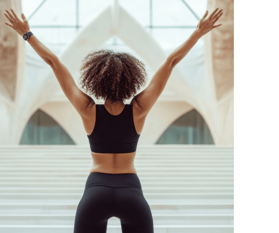 Woman celebrating empowerment and wellness - thriving through menopause transition