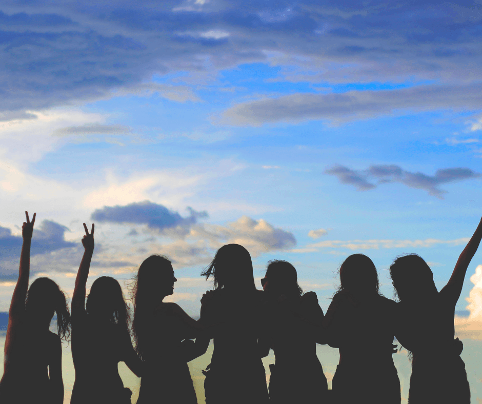 Women supporting each other at sunset - representing hope and connection